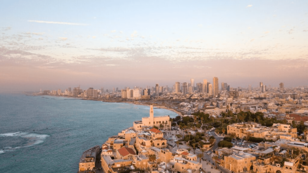 The Israeli coastline, the sea on the left and a cityscape on the right