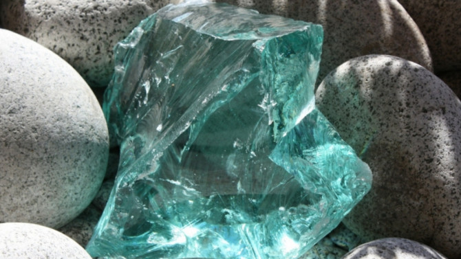 A turquoise gem among gray rocks